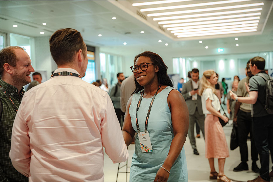 Attendees greeting each other